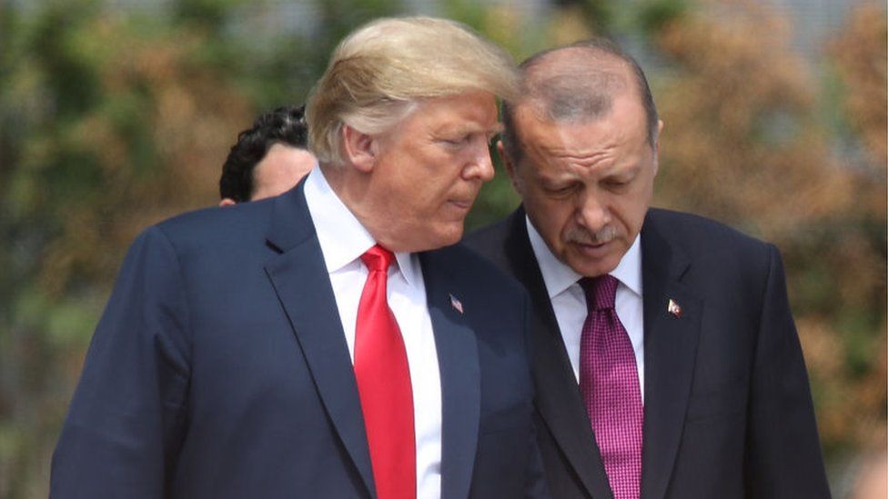 President Donald Trump (L) and Turkish President Recep Tayyip Erdogan attend the opening ceremony at the 2018 NATO Summit