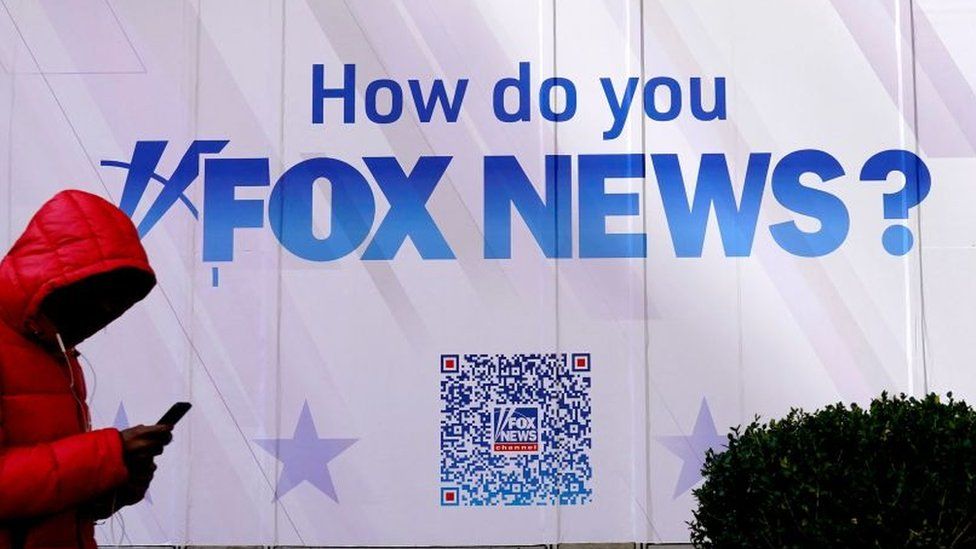 A person walks past the Fox News Headquarters at the News Corporation building in New York City.