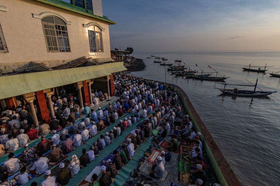 A large group of Indonesian Muslims pray at Al-Mabrur mosque in Surabaya, Indonesia