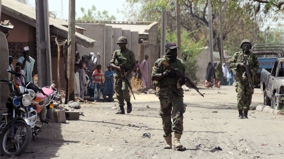 Nigerian troops patrolling in the streets of the remote northeast town of Baga, Borno State on 30 April, 2013