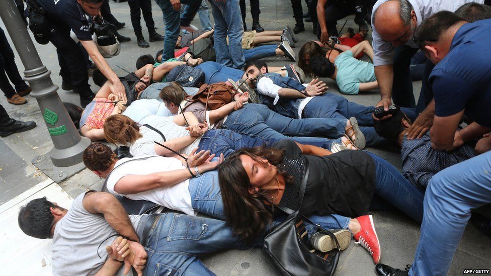 Demonstrators are detained by Turkish police officers in Ankara