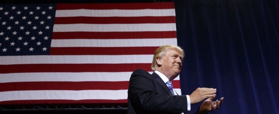 Donald Trump in front of US flag