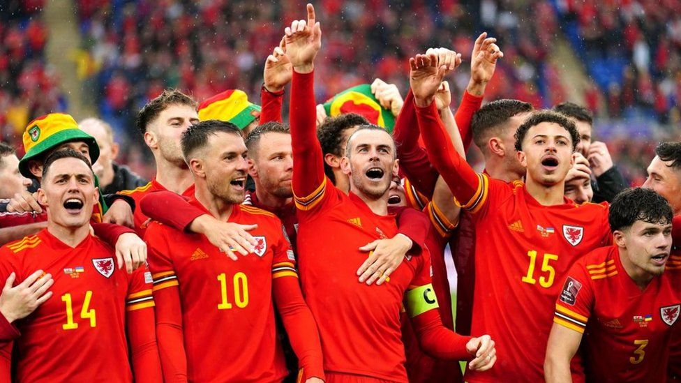 Wales' Gareth Bale celebrates with team-mates and staff after qualifying for the Qatar World Cup