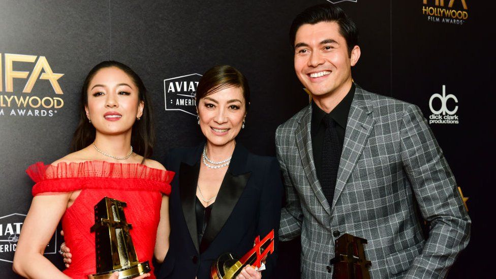 L-R) Constance Wu, Michelle Yeoh, and Henry Golding, recipients of the Hollywood Breakout Ensemble Award for 'Crazy Rich Asians, 2018