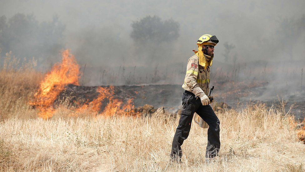 firefighter in catalonia wildfire