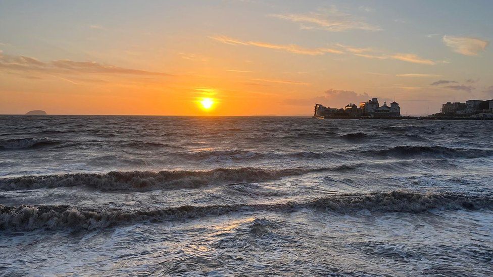 A sunset over a stormy sea at Weston-super-Mare