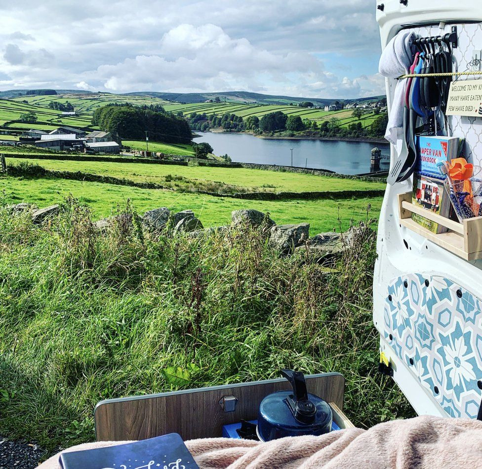 A view over the countryside from the back of a converted Berlingo