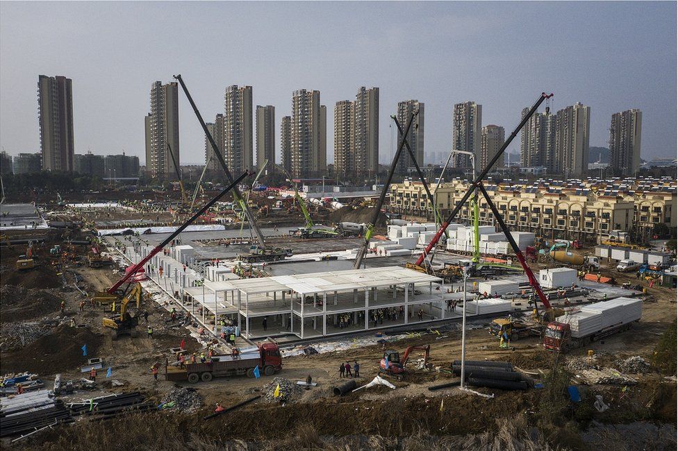 A view of cranes and diggers building Huoshenshan Hospital