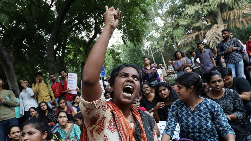 A student shouts slogans during a protest against the scrapping of the special constitutional status for Kashmir by the government, in Delhi, India, August 8, 2019