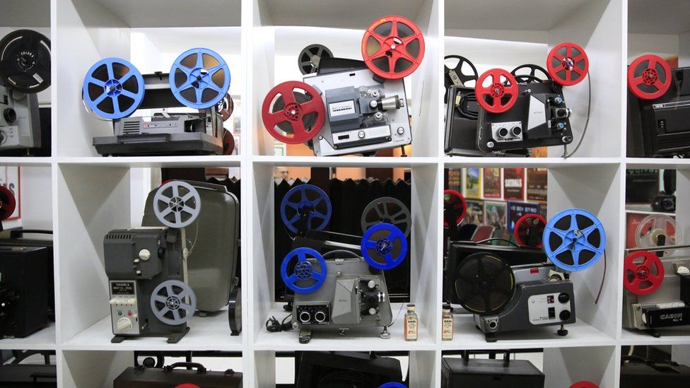 A selection of portable projectors on display at the Caliwood Museum in Colombia