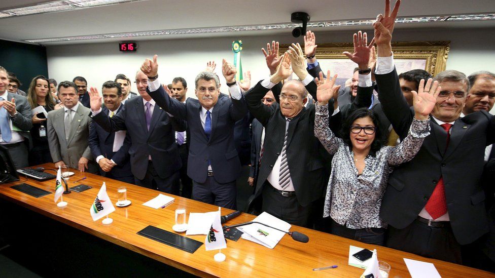 PMDB leaders celebrate after announcing they are withdrawing support for President Rousseff's ruling coalition during National Executive Meeting in Brasilia. March 29, 2016