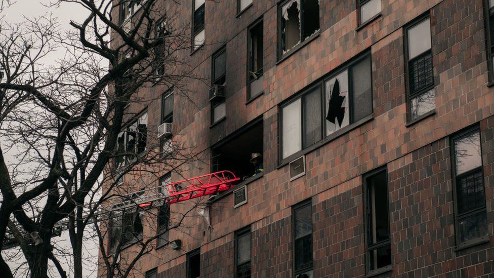A ladder is seen at a blaze at a New York apartment block fire