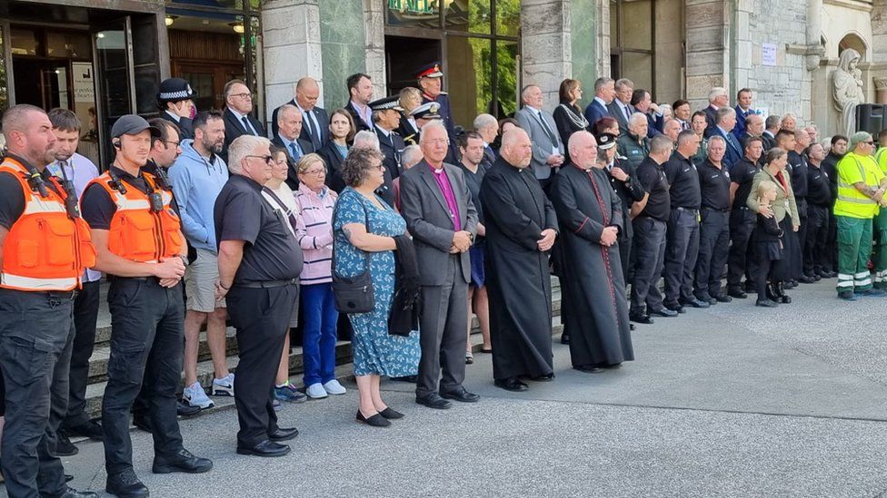 Civic leaders and council staff gathered outside The Guildhall