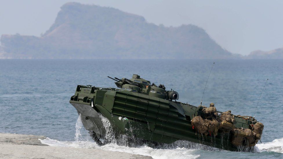 File photo: A US amphibious assault vehicle with Philippine and US troops on board storms the beach at a combined assault exercise at a beach facing one of the contested islands in the South China Sea known as the Scarborough Shoal in the West Philippine Sea, 21 April 2015