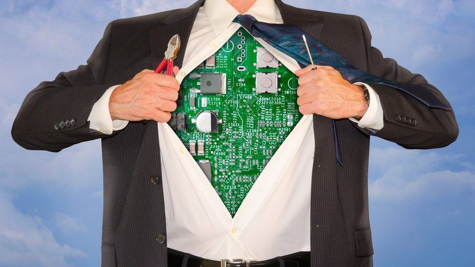 Man in suit revealing circuitboard chest