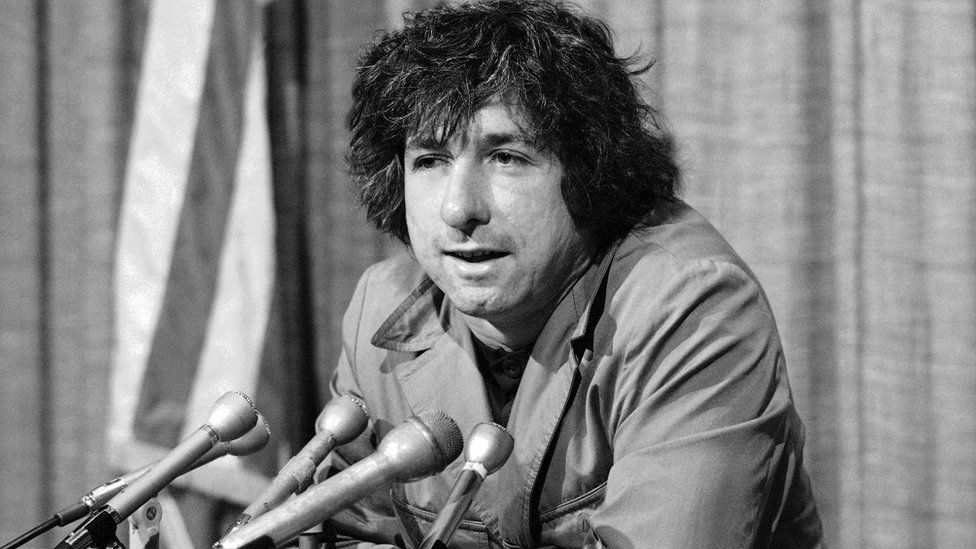 In this Dec. 6, 1973 file photo, political activist Tom Hayden, husband of Jane Fonda, tells newsmen in Los Angeles that he believes public support was partially responsible for the decision not to send him and others of the Chicago 7 to jail for contempt.