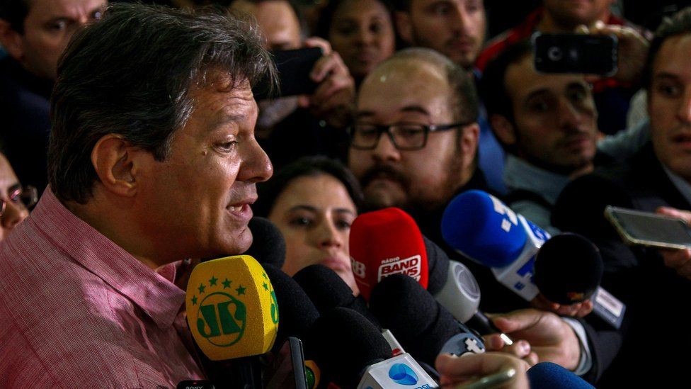 Presidential candidate Fernando Haddad addresses the press at a campaign rally in Sao Paulo on October 12, 2018