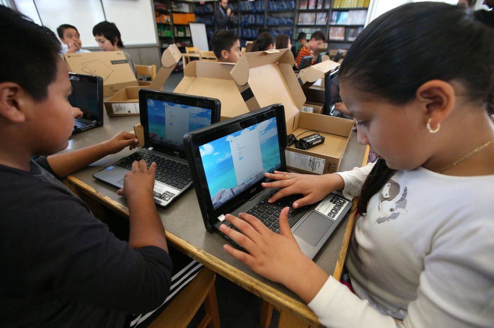 Pupils in California open new Chromebook laptop computers