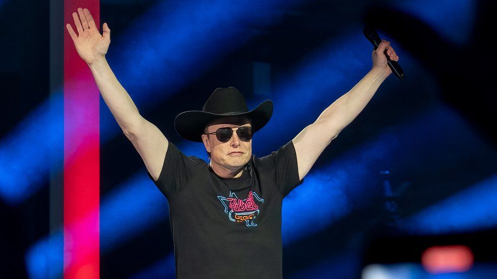 A photograph of Musk in a cowboy hat and sunglasses