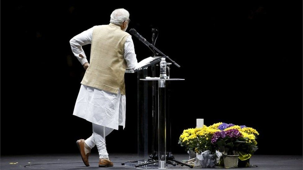 Indian Prime Minister Narendra Modi gestures as he speaks at a community reception at SAP Center in San Jose, California September 27, 2015