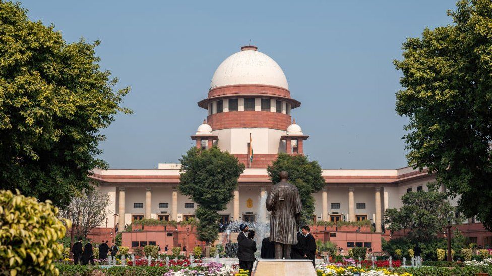 NEW DELHI, INDIA - 2023/12/11: Supreme Court of India during verdict of Article 370 in New Delhi Article 370, a temporary provision in the Indian Constitution, granted special autonomy to Jammu and Kashmir after it acceded to India in 1947. In August 2019, the BJP government, led by Prime Minister Narendra Modi, revoked Article 370, ending the region's special autonomy. The state was bifurcated into two Union Territories - Jammu & Kashmir and Ladakh. This decision triggered diverse reactions, both nationally and internationally, and underwent legal scrutiny, with the Supreme Court of India playing a pivotal role in adjudicating on its constitutional aspects. (Photo by Pradeep Gaur/SOPA Images/LightRocket via Getty Images)