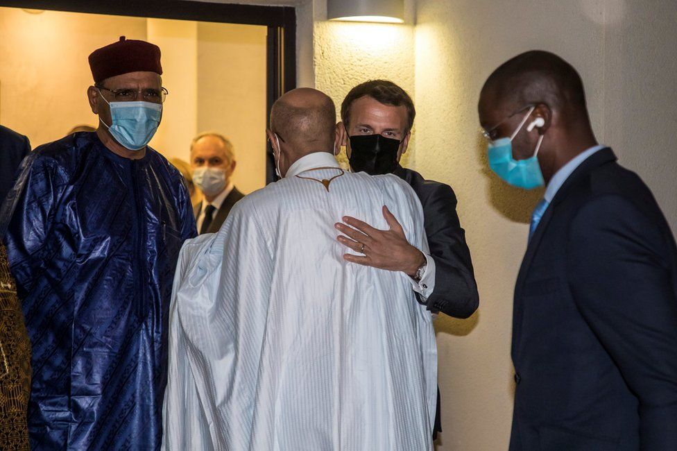 French President Emmanuel Macron greets President of Mauritania Mohamed Ould Cheikh El Ghazouani next to Niger"s President Mohamed Bazoum after a meeting with African leaders of the Sahel countries as part of the funerals of Chad President Idriss Deby in N"Djamena, Chad, April 22, 2021.