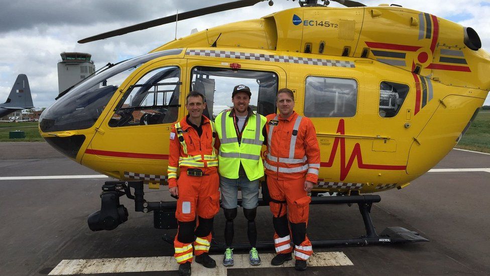 Shaun Whiter with the paramedics who helped to save his life