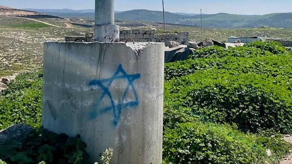 Star of David is seen as graffiti on concrete in Zanuta village