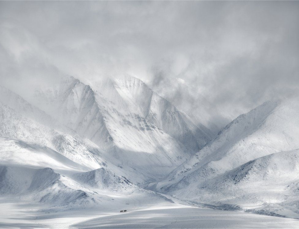 A landscape view of snow-covered mountains