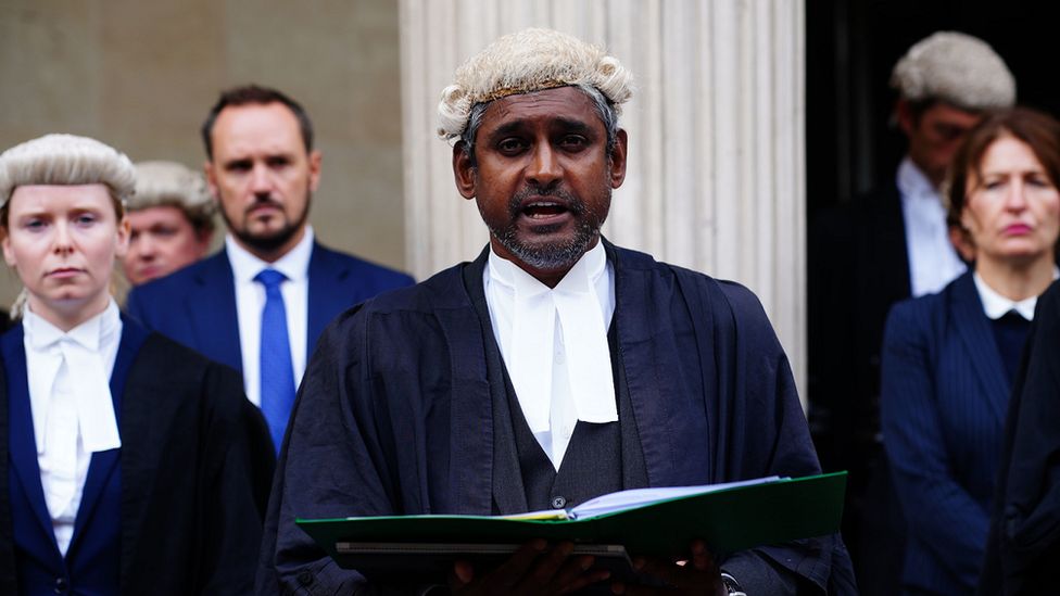 Criminal defence barrister, Kannan Siva, reads a statement outside Bristol Crown Court in support of strike action