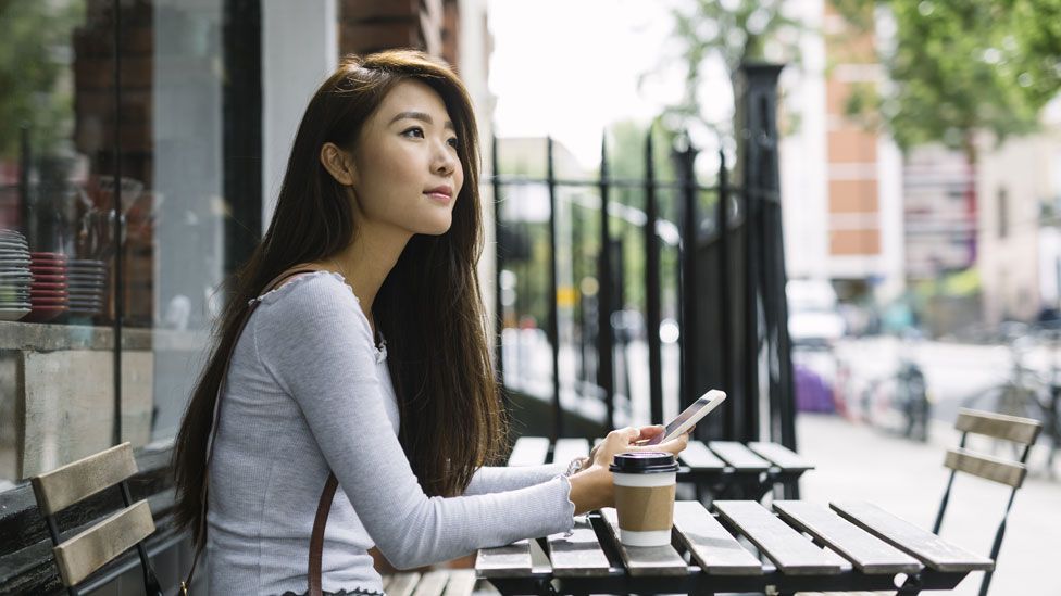 A woman using a smartphone (stock image)