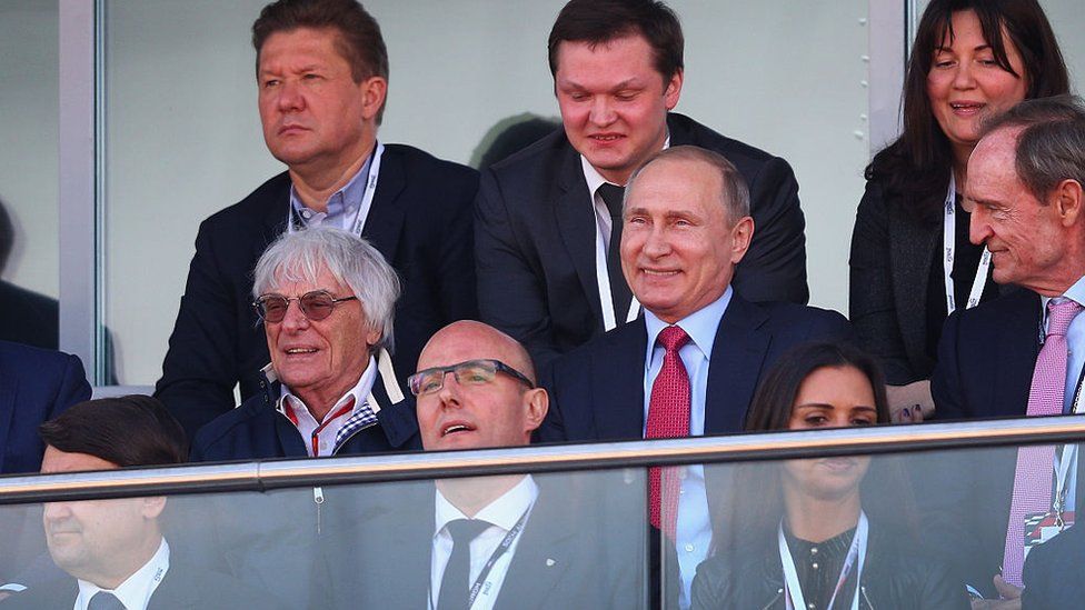 President of Russia Vladimir Putin sits next to F1 supremo Bernie Ecclestone at the Russian Formula One Grand Prix at Sochi Autodrom on May 1, 2016