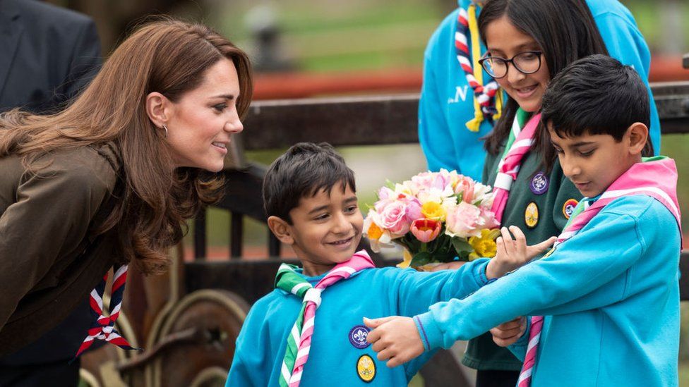 The Duchess of Cambridge with children on a visit to Scouts HQ in Gilwell Park, Essex, in March 2019