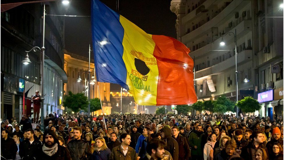 Romanians fill the Calea Victoriei, a main avenue of the Romanian capital, during a large protest in Bucharest, Romania, Tuesday, Nov. 3, 2015.