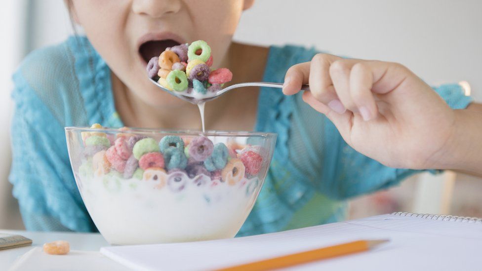 Child eating sugary cereal