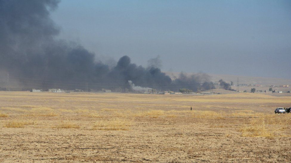 Smoke rises from clashes at Bartila to the east of Mosul during clashes with Islamic State militants, 18 October
