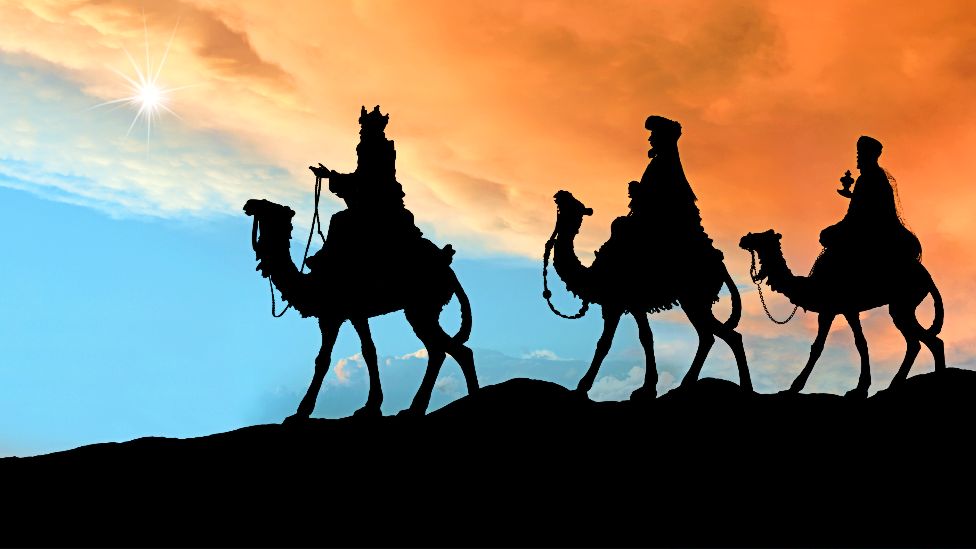 Stock image showing the biblical scene of three wise men on camels
