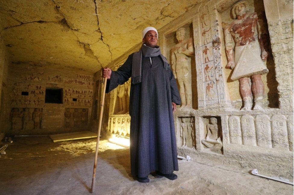 Mustafa Abdo, chief of excavation, stands inside the newly-discovered tomb of Wahtye