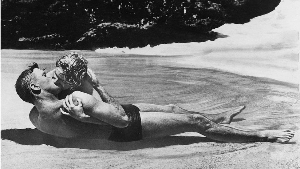 A scene in From Here to Eternity, in which she famously romped in the sea with Burt Lancaster.