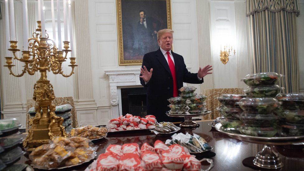 President Trump serves fast food dinner on silver platters - BBC Newsround