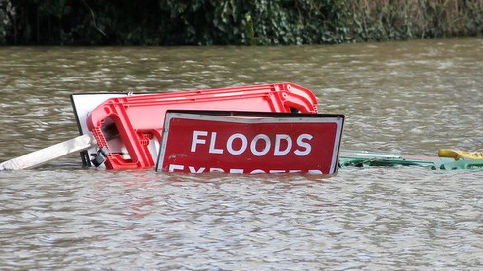Flood signs underwater as floods have risen over them in Shrewsbury Shropshire during floods in February 2020