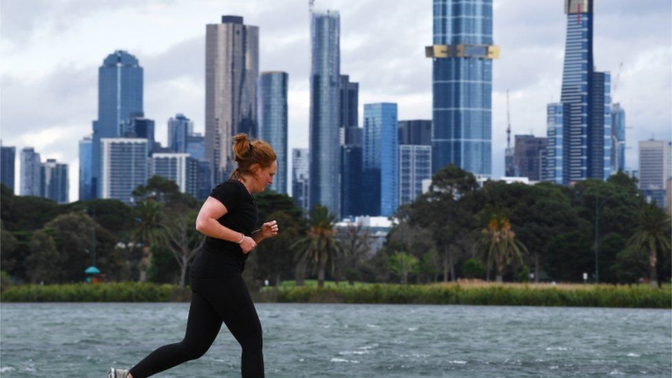 A woman jogs in Melbourne