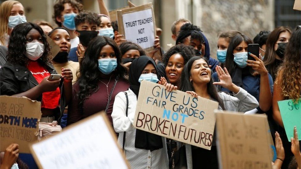 A-level students hold placards as they protest outside the Department for Education, amid the outbreak of the coronavirus disease (COVID-19), in London, Britain, August 16, 2020.