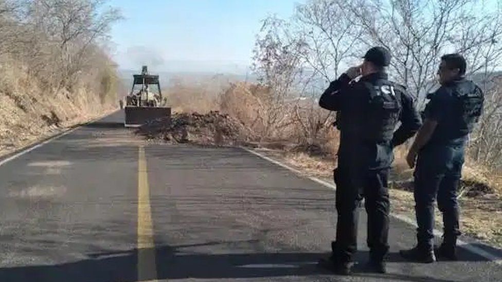 Road to Aguililla being cleared of debris by the security forces
