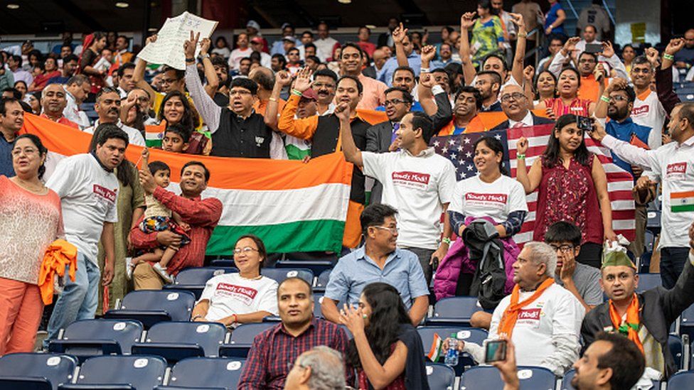 Attendees chant and cheer inside NRG Stadium ahead of a visit by Indian Prime Minister Narendra Modi in Houston, Texas