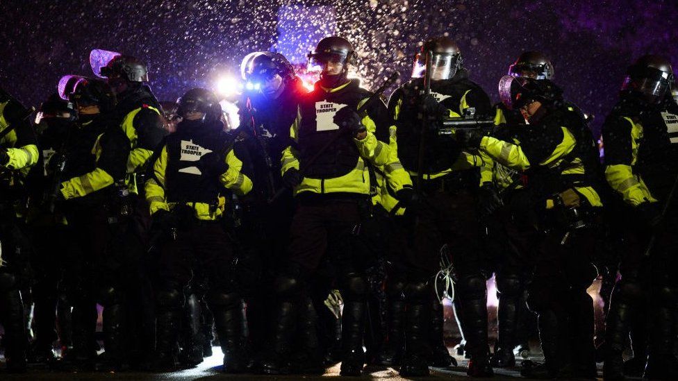 Police confront protesters outside Brooklyn Center police HQ - 13 April