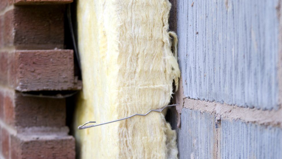 Insulation lined between outdoor brick wall and interior cement wall