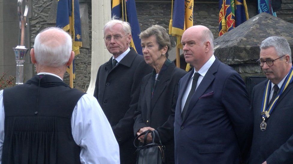 Mourners outside St Peter's Church in Onchan
