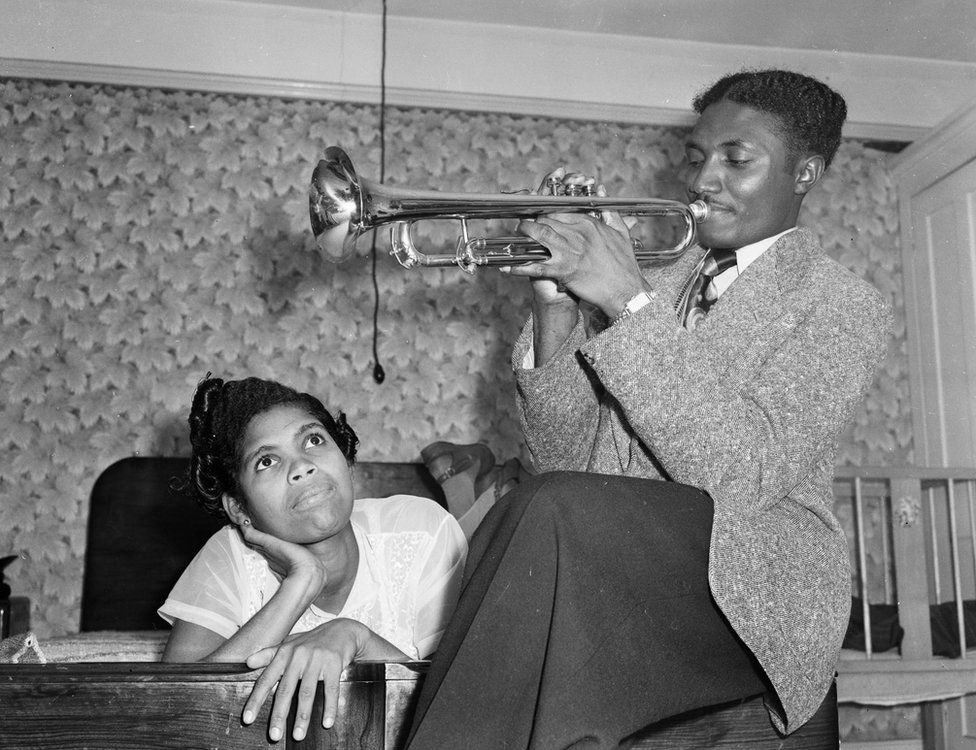 Keith Edwards and Queenie Marques, immigrants from Jamaica, are seen in a bedroom in 1954