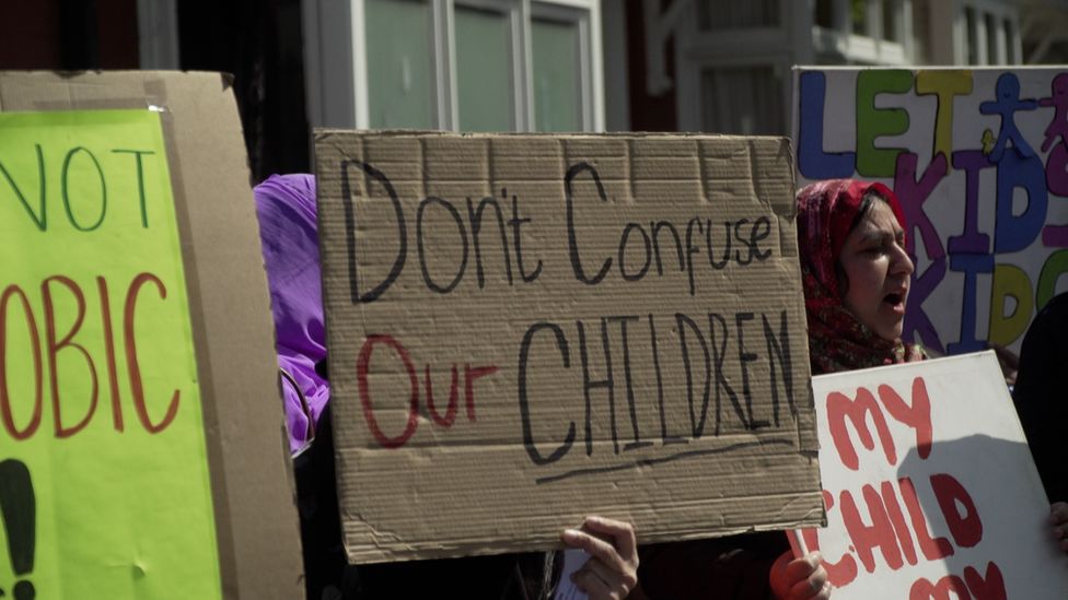 Protestor holds a sign